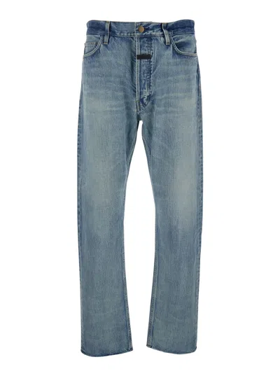 FEAR OF GOD BLUE FIVE-POCKET JEANS WITH FRONT LOGO PATCH IN DENIM MAN