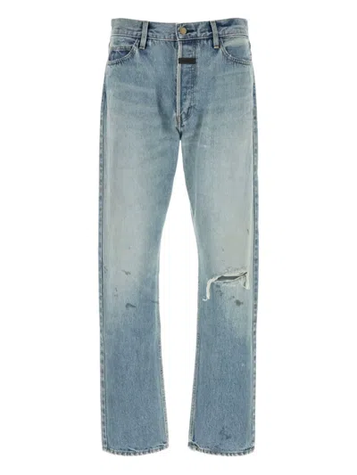FEAR OF GOD DISTRESSED LIGHT-WASH JEANS