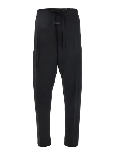 FEAR OF GOD BLACK PANTS WITH FRONT KNOT CLOSURE AND LOGO PATCH IN COTTON AND WOOL BLEND WOMAN