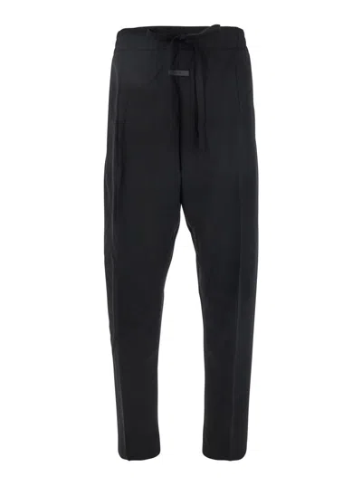 FEAR OF GOD BLACK PANTS WITH FRONT KNOT CLOSURE AND LOGO PATCH IN COTTON AND WOOL BLEND WOMAN