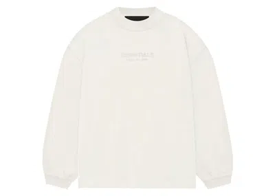 Pre-owned Fear Of God Essentials Kids Long Sleeve T-shirt In Cloud Dancer