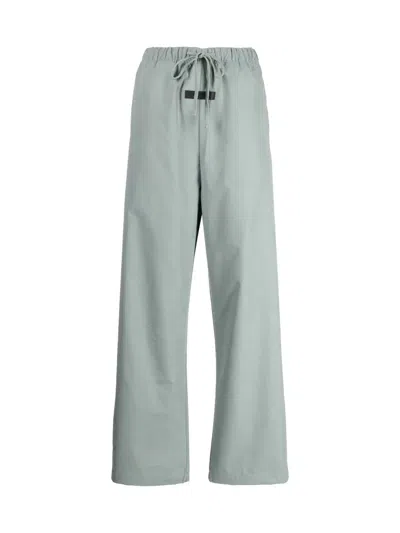 Fear Of God Essentials Logo Relaxed Trousers In Green