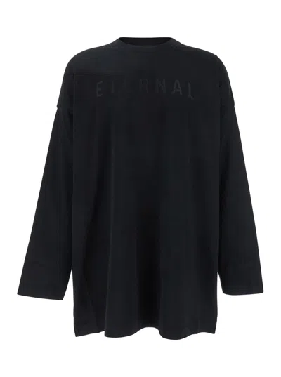 FEAR OF GOD BLACK T-SHIRT WITH ETERNAL PRINT ON THE FRONT AND LOGO PATCH ON THE BACK