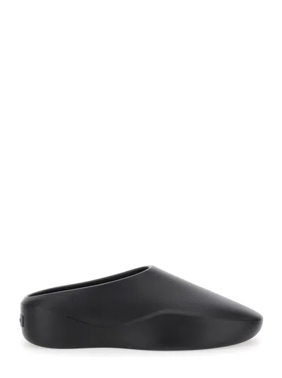 FEAR OF GOD 'EVA RUNNER' BLACK SNEAKERS WITH LOGO ON THE HEEL AND SIDE CUT-OUT DETAIL IN PLASTIC MAN