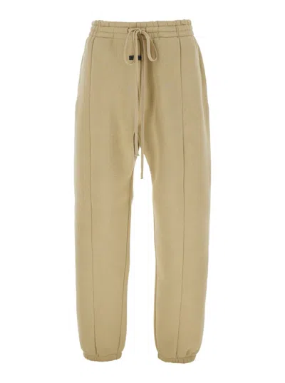 FEAR OF GOD 'FORUM' BEIGE PANTS WITH ELASTIC DRSWSTRING WAIST AND LOGO PATCH ON THE FRONT IN COTTON BLEND MAN