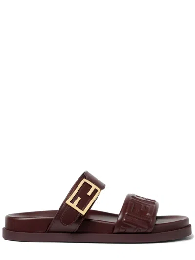 FENDI FENDI DOUBLE-BAND SLIDES WITH DECORATIVE BUCKLE AND EMBOSSED MOTIF