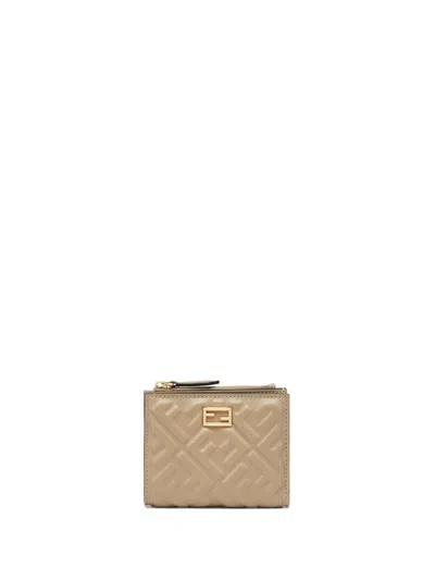 Fendi Logo Embossed Zipped Wallet In Beige