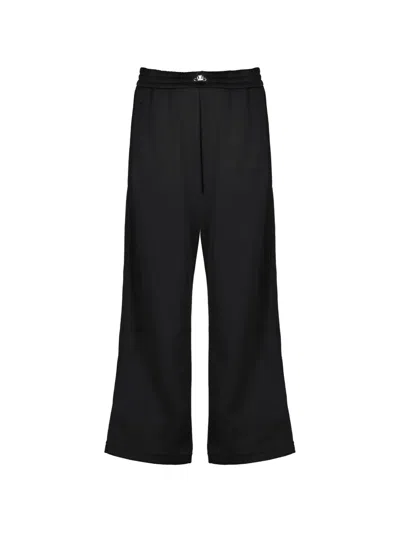 Fendi Logo Engraved Trim Trousers In Black
