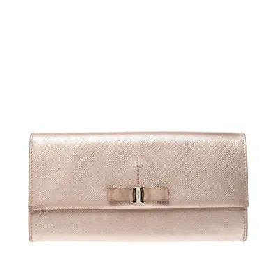 Ferragamo Beige Metallic Leather Bow Continental Wallet In Gold