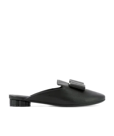 Ferragamo Bow-tie Flat-soled Muller Shoes In Black