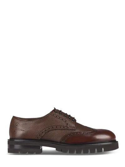 Ferragamo Brogue Leather Flat Shoes With Intricate Perforations In Black