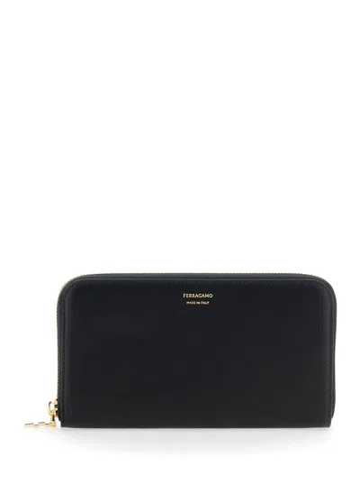 FERRAGAMO CONTINENTAL BLACK WALLET WITH LOGO LETTERING ON THE FRONT IN LEATHER WOMAN