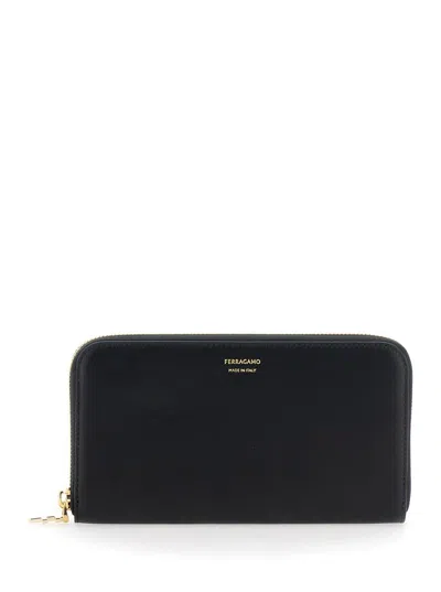 FERRAGAMO 'CONTINENTAL' BLACK WALLET WITH LOGO LETTERING ON THE FRONT IN LEATHER WOMAN