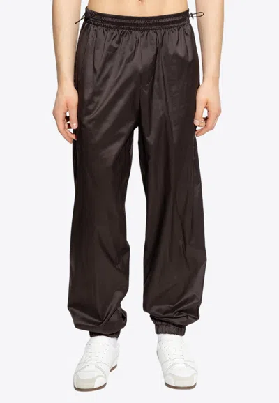 FERRAGAMO CRINKLED SILK TRACK PANTS