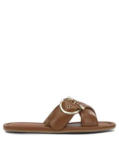 Ferragamo Elyzia Flat Cross Strap Buckle Slides In Brown
