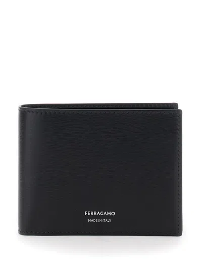 FERRAGAMO FLORENCE BLACK BI-FOLD WALLET WITH LOGO LETTERING ON THE FRONT IN LEATHER MAN