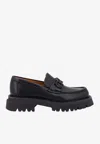 Ferragamo Chunky Sole Loafers With Metal Buckle Detail In Black