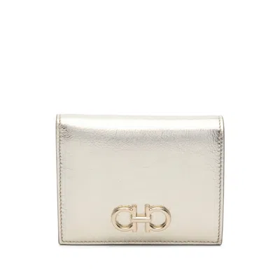 Ferragamo Gancini Buckle Compact Wallet In Gold