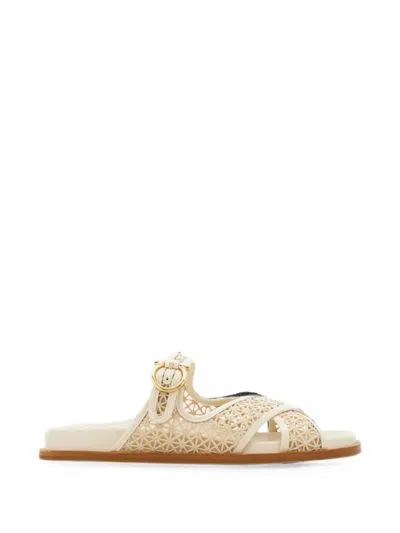 Ferragamo Gancini Buckle Crossover Slides In Gold