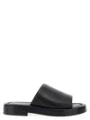Ferragamo Logo Embossed Leather Slides In Black