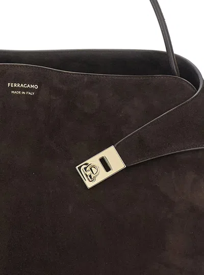 FERRAGAMO 'HUG' BROWN SHOULDER BAG WITH LOGO PRINTED ON FRONT IN SUEDE WOMAN