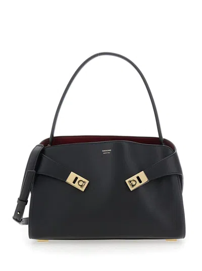 FERRAGAMO 'HUG' BLACK SHOULDER BAG WITH LOGO PRINT ON THE FRONT IN LEATHER WOMAN