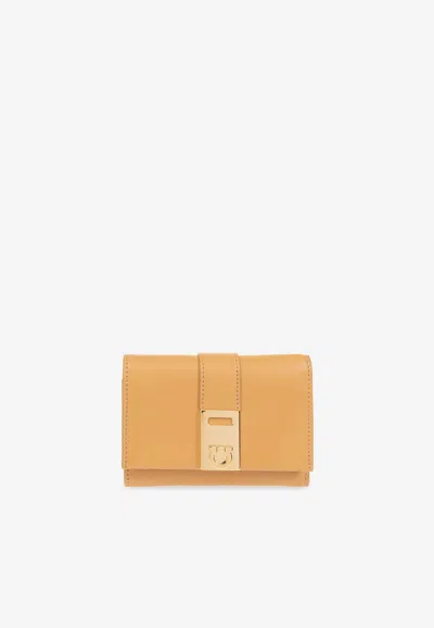 Ferragamo Hug Tri-fold Leather Wallet In Camel