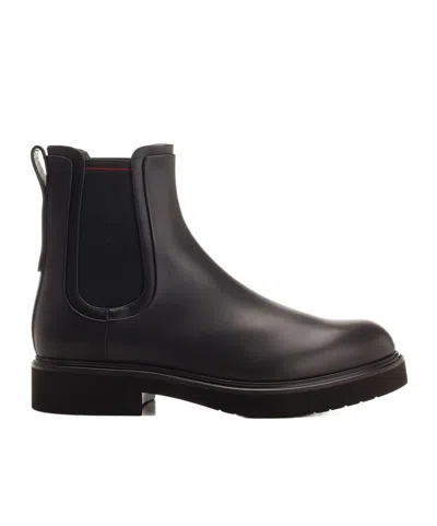 Ferragamo Logo Embossed Boots In Black