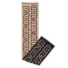 Ferragamo Logo Print Wool Scarf In Black
