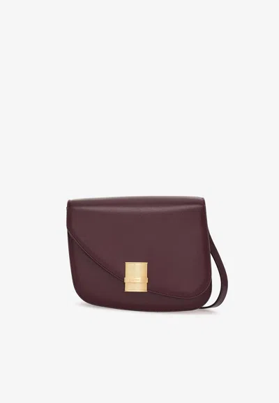 Ferragamo Medium Asymmetric Leather Shoulder Bag In Bordeaux