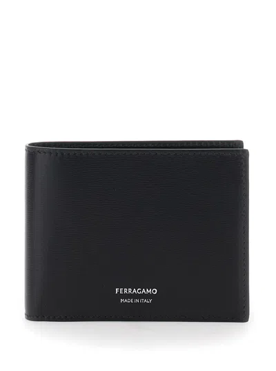 FERRAGAMO FERRAGAMO MEN 'FLORENCE' BLACK BI-FOLD WALLET WITH LOGO LETTERING ON THE FRONT IN LEATHER MAN