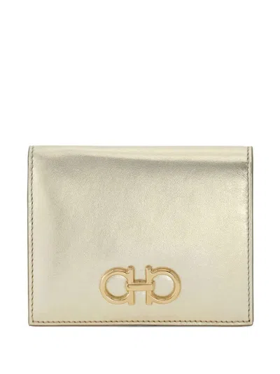 Ferragamo Compact Gancini Wallet In Laminated Leather In Gold