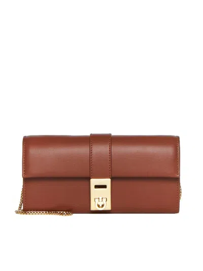 Ferragamo Gancini Clutch Bag In Brown