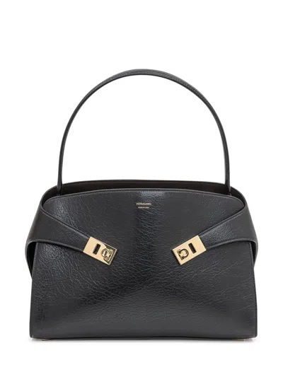 FERRAGAMO SALVATORE FERRAGAMO FERRAGAMO BLACK LEATHER BAG WITH GOLDEN DETAILS