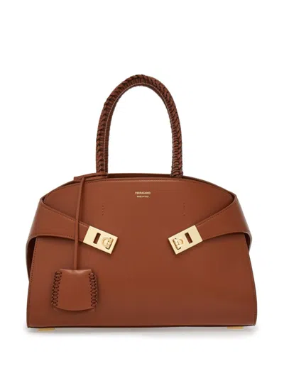Ferragamo Small Hug Calf Leather Top Handle Bag In Cognac