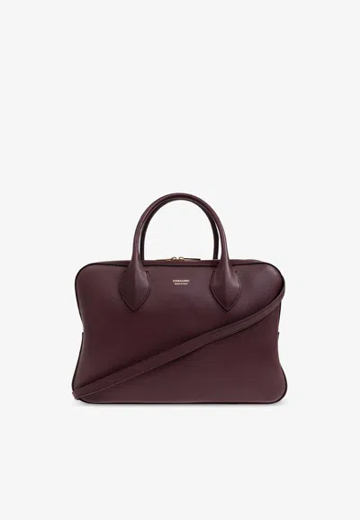 Ferragamo Stella Logo Embossed Top Handle Bag In Burgundy