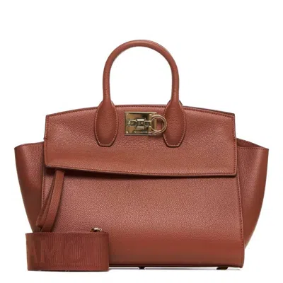 Ferragamo Studio Logo-plaque Top Handle Bag In Brown