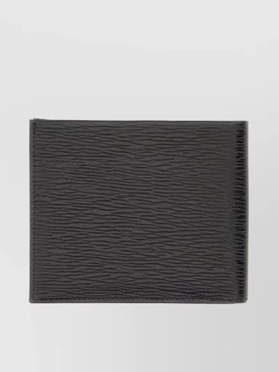 FERRAGAMO TEXTURED BI-FOLD WALLET GANCINI DETAIL