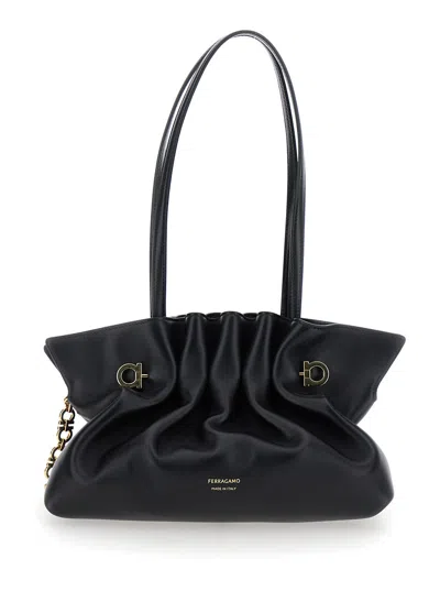 FERRAGAMO FERRAGAMO WOMEN BLACK CROSSBODY BAG WITH EMBOSSED LOGO LETTERING ON THE FRONT AND GANCINI IN LEATHER