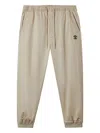 Fingercroxx Logo-patch Cuffed Trousers In Gray