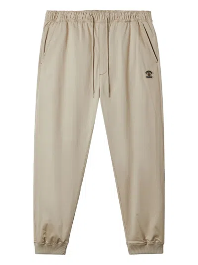 Fingercroxx Logo-patch Cuffed Trousers In Gray