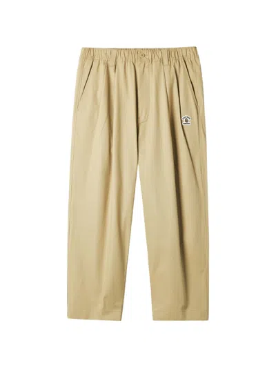 Fingercroxx Logo-patch Trousers In Brown
