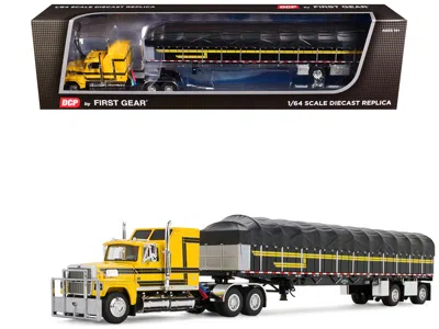 First Gear Ford Ltl 9000 With 60" Aerodyne Sleeper And 53' Wilson Roadbrute Flatbed Trailer With Covered Wagon  In Multi