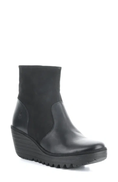 Fly London Yuxi Wedge Boot In Black Dublin/ Cup