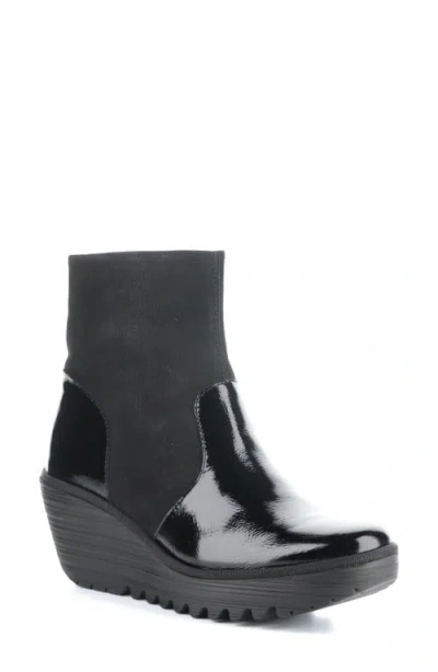 Fly London Yuxi Wedge Boot In Black Nappalak