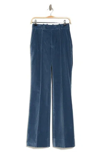 Frame The Slim Stacked Velvet Trousers In Denim Blue