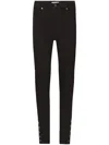 Frame The Snapped Skinny Jeans In Black