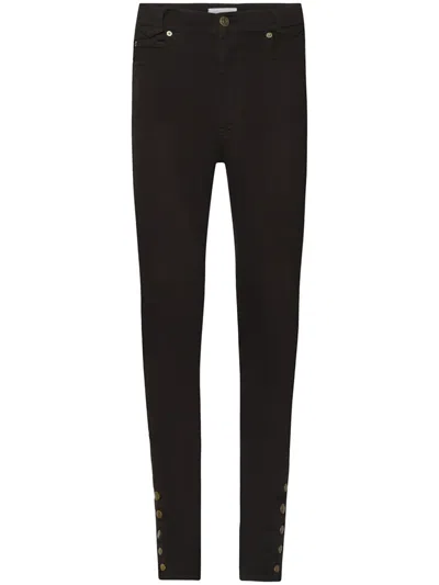 Frame The Snapped Skinny Jeans In Black