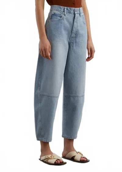 Frame The Twisted High-rise Barrel Jeans In Never In Black