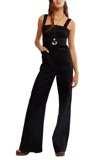 Free People Suns Out Denim Bootcut Jumpsuit In Black